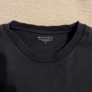 Woman’s dark gray shirt